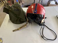 Helmet and carry bag on table surface