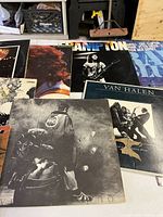 Partial view showing Peter Frampton, Van Halen, The Who and Led Zeppelin LP covers