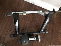 Full view of Blackburn TrakStand magnetic bike trainer showing black metal stand and resistance unit.