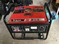 Front view of generator showing control panel, outlets and frame
