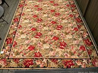 Full view of carpet showing overall floral design and condition