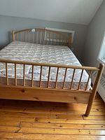 Front view of bed frame showing headboard and footboard