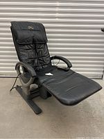 Left side view of the entire chair showing backrest, armrest and leg rest extended