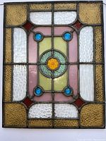 Front view of the stained glass window showing all colored glass sections and the central star