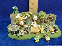 Front angle showing the full Garfield barbecue scene with ruler for size reference