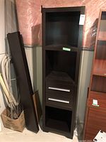 Full view of the faux wood cabinet, showing its overall structure, color, and dimensions in standing position.