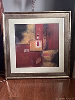 Full view of the framed abstract print showing composition and frame details.