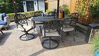 Full set on patio showing table and six chairs