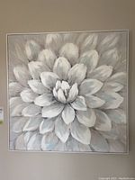 Full front view of framed floral canvas print showing the flower design and frame.