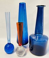 All four glass vases standing together