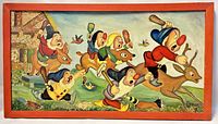 Front view of the framed oil painting showing Snow White's dwarfs chasing with a reindeer, signed Grace.