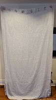 Full white drapery panel measuring 52x96 inches showing linen texture and hanging grommets