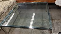 Top view of the oversized square glass top coffee table showing thickness and transparency of glass surface