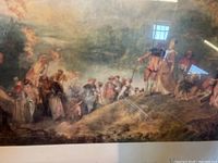Framed paper print showing a group of 18th-century figures in period dress outdoors, with cloudy sky and landscape background. Reflections visible on glass surface.