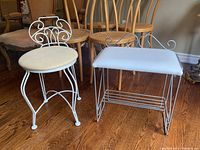 Photo showing both the white wire frame chair and matching bench on hardwood floor, with scroll design on chair back and cushioned seats