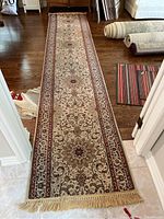 Full-length view of runner laid on hardwood floor