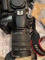 Canon EOS 60D body mounted with Sigma 18-200mm f/3.5-6.3 OS lens