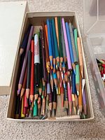 Box with assorted colored pencils showing tips and colors