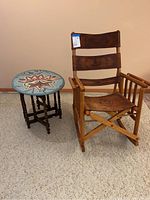 Front view of rocker and side table on carpet against wall