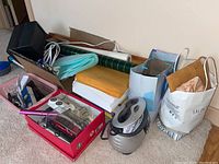 Wide view of file box, envelopes, wrapping paper, foam sheets, and bags containing items