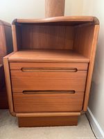Front view of one bedside table showing two drawers and open shelf