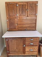 Full front view showing entire cabinet with upper and lower sections and extended pull-out counter