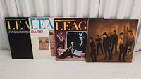 Four vinyl records by The Human League displayed with covers showing various album artwork and titles.