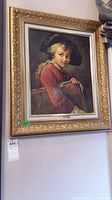 Framed art showing the full piece hanging on wall with ornate frame.