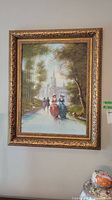 View of the original framed oil painting showing figures walking on a pathway towards a castle with trees and water. The signature is visible at the bottom right.