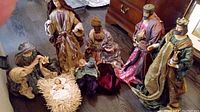 Group photo of the nativity figures arranged on a floor showing all main characters.