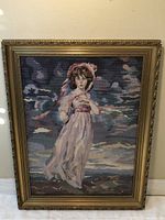 Frontal image of the hand-done needlepoint artwork depicting Pinkie by Thomas Lawrence, showcasing the ornate gold frame and detailed needlework colors and design.