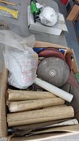Box with rolls and tubes of sandpaper, various abrasive discs
