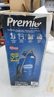 Photo showing Chapin Premier sprayer box with product and usage information including herbicide, insecticide, and fertilizer use in multiple languages and visuals of the sprayer with hose and wand.
