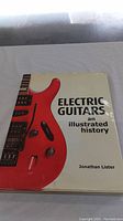 Front cover of the book showing a red electric guitar and title text.
