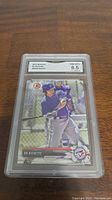 Front view of 2017 Bowman Bo Bichette rookie card in a GMA protective holder showing player batting.