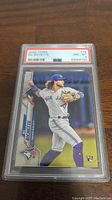 Front view of the 2020 Topps Bo Bichette Rookie card in PSA graded slab showing player in Blue Jays uniform throwing ball.