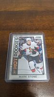 Close-up image of Mark Stone Hot Rookies hockey card in plastic protective case showing the front design with player in Ottawa Senators uniform.