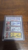 Front of Iconic Ink trading card showing triple facsimile autographs of Pete Rose, Ken Griffey Jr., and Johnny Bench, with photos of each player and clear protective case.