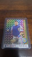 Photo of 1995 Tom Brady baseball card in holographic draft style featuring Tom Brady in Montreal Expos uniform.
