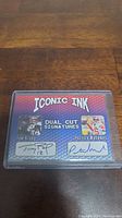 Front side of the Iconic Ink collectible card showing facsimile signatures of Tom Brady and Patrick Mahomes II