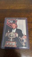 Photo of Wayne Gretzky NHL Pro Set hockey card showing Gretzky with trophies.