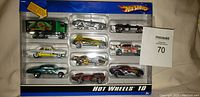Photo of original Hot Wheels 10 car collection in packaging, showing all included cars arranged in plastic tray.
