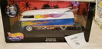 Photo of Hot Wheels customized VW drag bus die-cast model inside original packaging with clear display case.