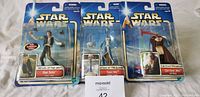 Photo showing three new Star Wars action figures in original packaging: Han Solo, Anakin Skywalker, Qui-Gon Jinn.