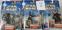 Photo showing three Star Wars action figures in original packaging: Teemto Pagalies, Ojas Puhr, and Darth Maul, all with character cards and accessories visible.