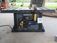Front view showing Mastercraft brand and 10" Bench Saw labeling, control knob and power switch visible with yellow adjustment knobs.