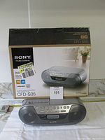 Sony CFD-S05 portable stereo placed in front of original box showing product image and labels.