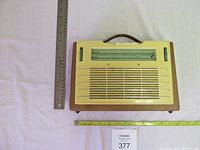 Top view of the radio with rulers showing size.