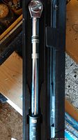 Photo of Mastercraft digital torque wrench in black plastic case showing wrench details and digital display.
