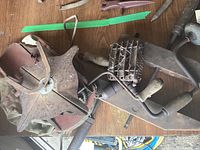 Top view of vintage seed sower, clamp, hand drill, and antique grooming brush showing condition and details.